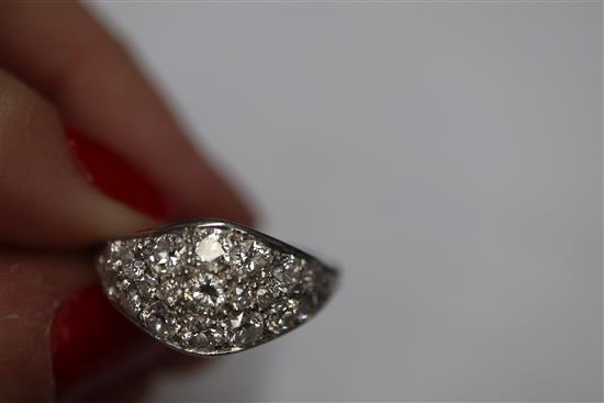 A white metal and diamond cluster set elliptical shaped ring, size H/I.